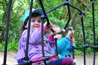 Children climbing the spider's web netting at the Nene Wetlands