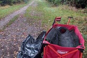 Trolley and rubbish bag on Cambourne Nature Reserve by Rebecca Neal